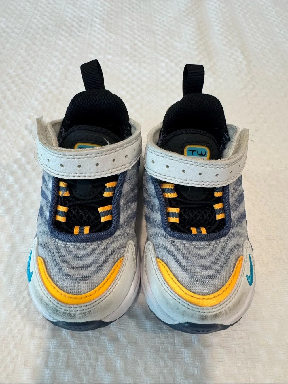 Nike Kids Sneakers in White, Black, Yellow & Blue